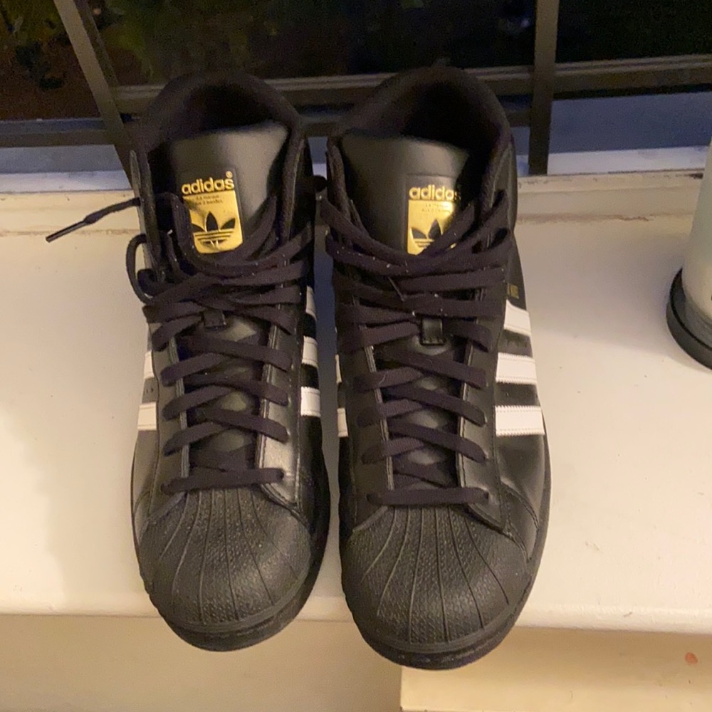 High Top Black and a white adidas size 10 1/2 in men worn only 1 time good cond.